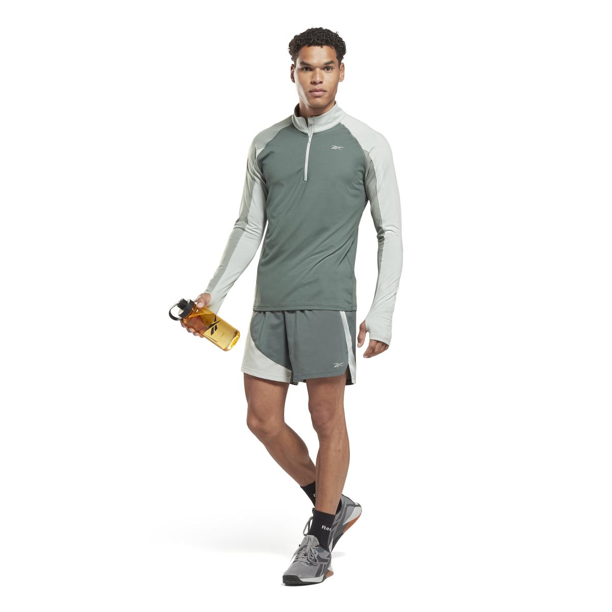 product/r/e/reebok_ht3712_4_apparel_on_model_side_view_white.jpg